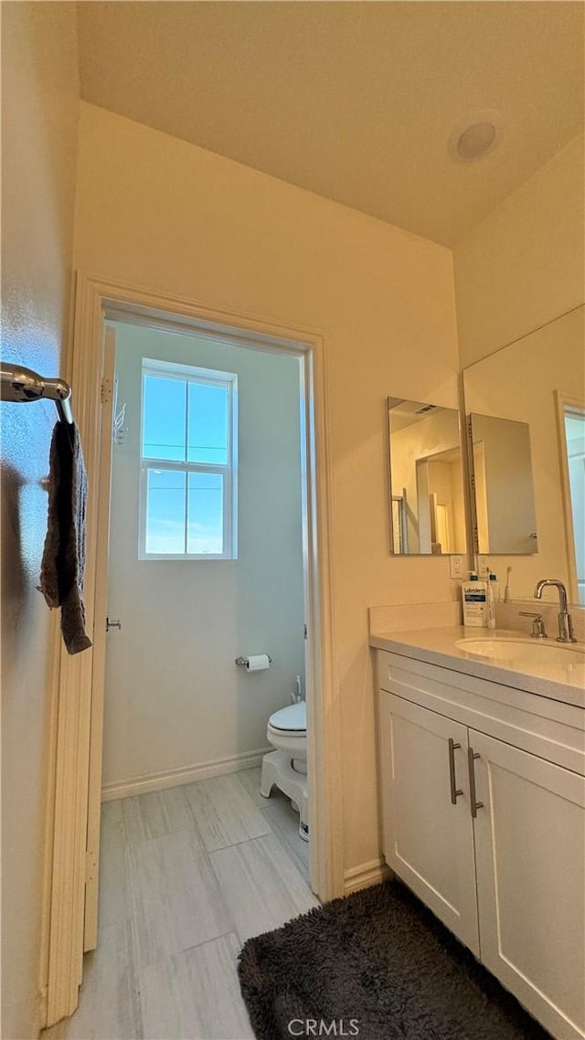 1416 Vigilant, Carson, CA 90746 - bathroom with vanity, toilet, and baseboards