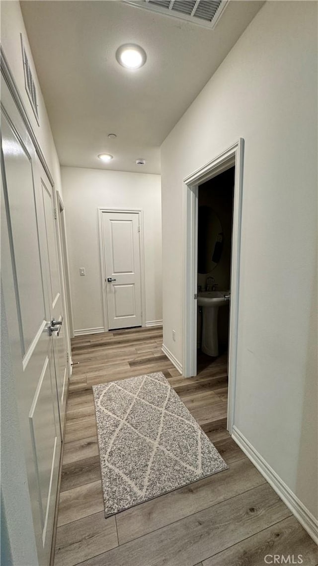 1416 Vigilant, Carson, CA 90746 - corridor featuring baseboards, light wood-style flooring, and recessed lighting