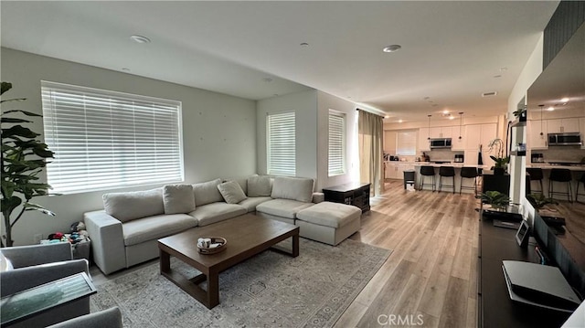1416 Vigilant, Carson, CA 90746 - living area featuring light wood finished floors and healthy amount of natural light
