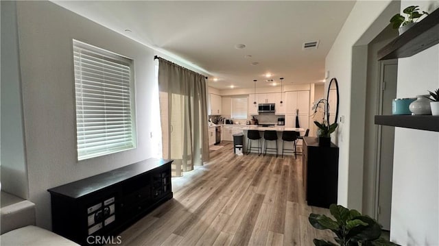 1416 Vigilant, Carson, CA 90746 - living area with light wood finished floors and recessed lighting