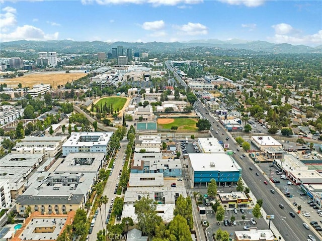 7049 Vassar Ave, Canoga Park, CA 91303 - aerial view of property's location featuring nearby urban area and a mountainous background