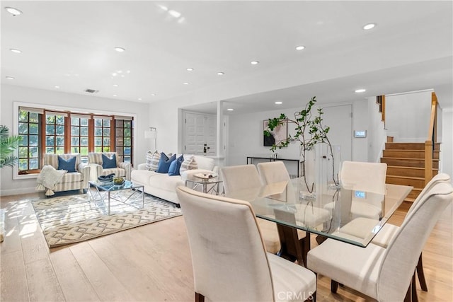 5144 Meadow Wood Ave, Lakewood, CA 90712 - dining space with light wood-style floors, recessed lighting, and stairs