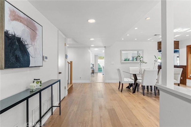5144 Meadow Wood Ave, Lakewood, CA 90712 - dining space with recessed lighting and light wood-style floors