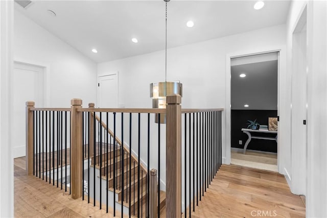 5144 Meadow Wood Ave, Lakewood, CA 90712 - hallway with an upstairs landing, light wood finished floors, recessed lighting, and vaulted ceiling