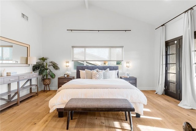 5144 Meadow Wood Ave, Lakewood, CA 90712 - bedroom with high vaulted ceiling, light wood-style floors, and beamed ceiling