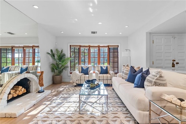 5144 Meadow Wood Ave, Lakewood, CA 90712 - living area featuring recessed lighting, plenty of natural light, wood finished floors, and french doors