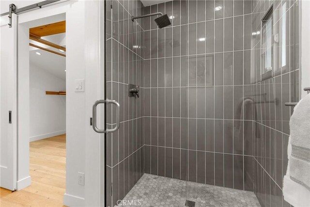 5144 Meadow Wood Ave, Lakewood, CA 90712 - full bathroom featuring a shower stall and wood finished floors