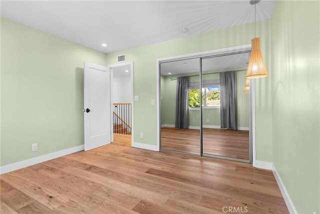 5144 Meadow Wood Ave, Lakewood, CA 90712 - unfurnished bedroom featuring wood finished floors, a closet, and recessed lighting