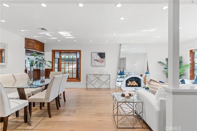 5144 Meadow Wood Ave, Lakewood, CA 90712 - dining space featuring recessed lighting, light wood-style floors, and healthy amount of natural light