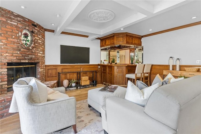 5144 Meadow Wood Ave, Lakewood, CA 90712 - living area featuring beamed ceiling, recessed lighting, a fireplace, light wood-type flooring, and a wainscoted wall