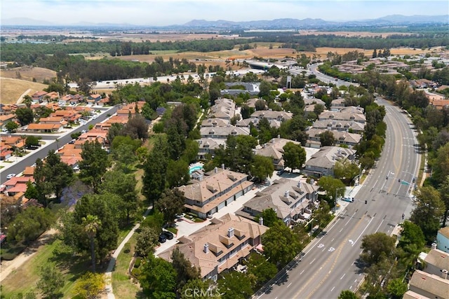 6375 Woodrow Ct Unit 3, Chino Hills, CA 91709 - aerial view of property and surrounding area with nearby suburban area, a major roadway, and a mountainous background