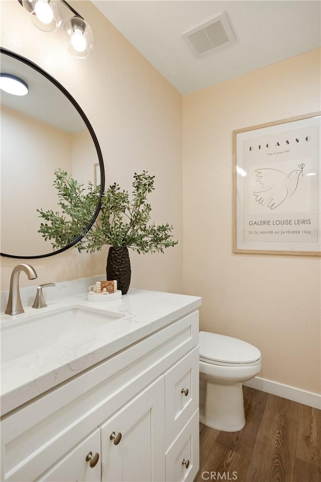 6375 Woodrow Ct Unit 3, Chino Hills, CA 91709 - half bathroom with vanity, wood finished floors, toilet, and baseboards