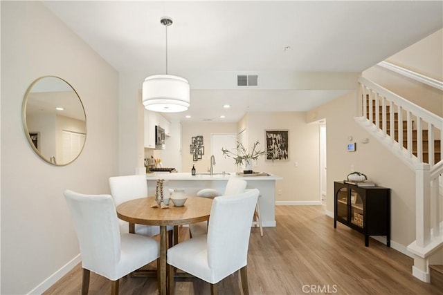 6375 Woodrow Ct Unit 3, Chino Hills, CA 91709 - dining area featuring stairway, baseboards, light wood-style floors, and recessed lighting
