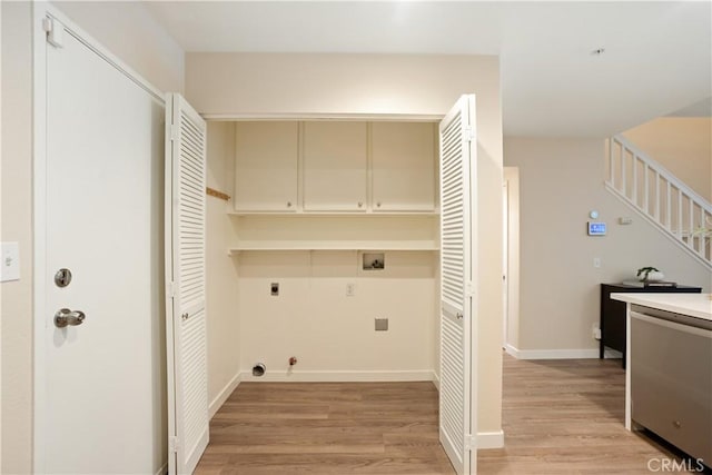 6375 Woodrow Ct Unit 3, Chino Hills, CA 91709 - laundry room with hookup for an electric dryer, washer hookup, light wood-type flooring, hookup for a gas dryer, and cabinet space