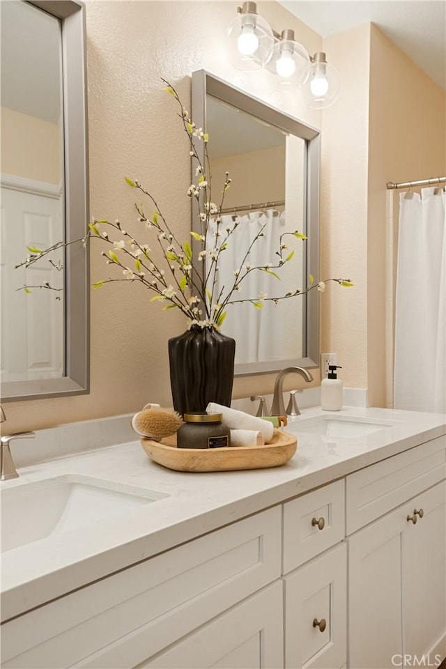 6375 Woodrow Ct Unit 3, Chino Hills, CA 91709 - bathroom featuring double vanity and a textured wall