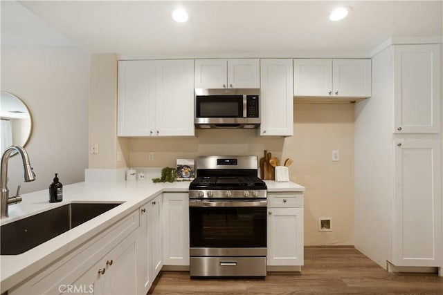 6375 Woodrow Ct Unit 3, Chino Hills, CA 91709 - kitchen featuring stainless steel appliances, a sink, white cabinetry, light countertops, and recessed lighting