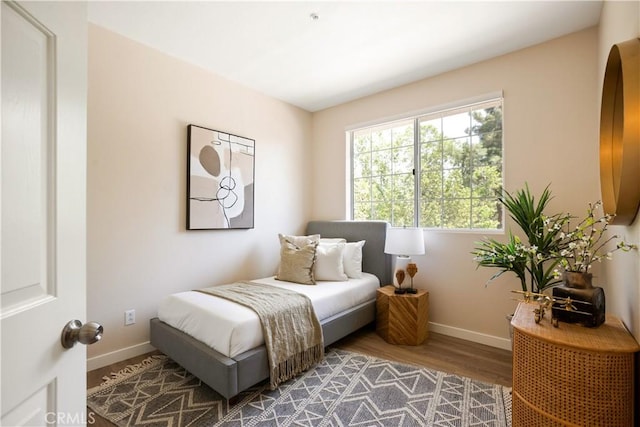 6375 Woodrow Ct Unit 3, Chino Hills, CA 91709 - bedroom with baseboards and wood finished floors