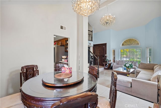 2350 Robert Rd, Rowland Heights, CA 91748 - dining room featuring high vaulted ceiling, a chandelier, light tile patterned flooring, and stairs