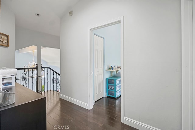 2350 Robert Rd, Rowland Heights, CA 91748 - hall featuring baseboards, dark wood-style floors, an upstairs landing, and a chandelier