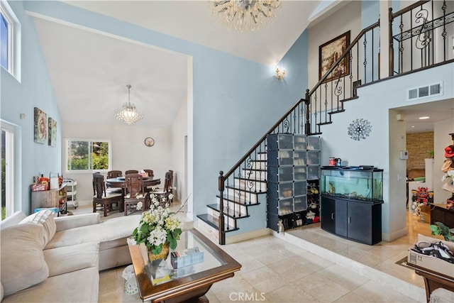 2350 Robert Rd, Rowland Heights, CA 91748 - living room featuring a chandelier, high vaulted ceiling, stairs, baseboards, and tile patterned floors