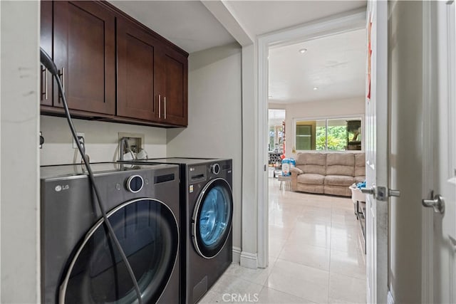 2350 Robert Rd, Rowland Heights, CA 91748 - laundry area with cabinet space, washer and clothes dryer, light tile patterned flooring, and baseboards