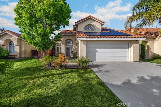 27472 Swallow Ct, Temecula, CA 92591 - mediterranean / spanish-style home with stucco siding, concrete driveway, roof mounted solar panels, and a front yard