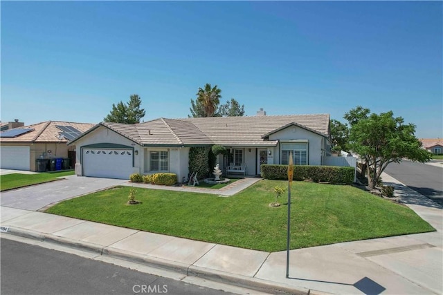 14194 De Sota Dr, Victorville, CA 92392 - ranch-style home featuring a tile roof, a garage, a front yard, concrete driveway, and stucco siding