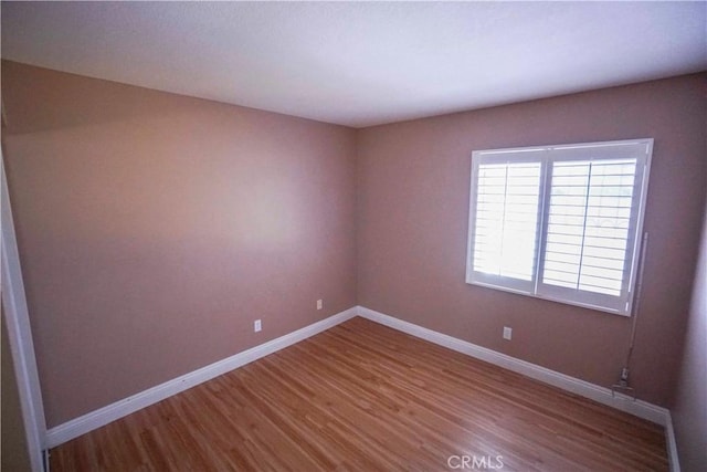 14194 De Sota Dr, Victorville, CA 92392 - unfurnished room featuring wood finished floors and baseboards