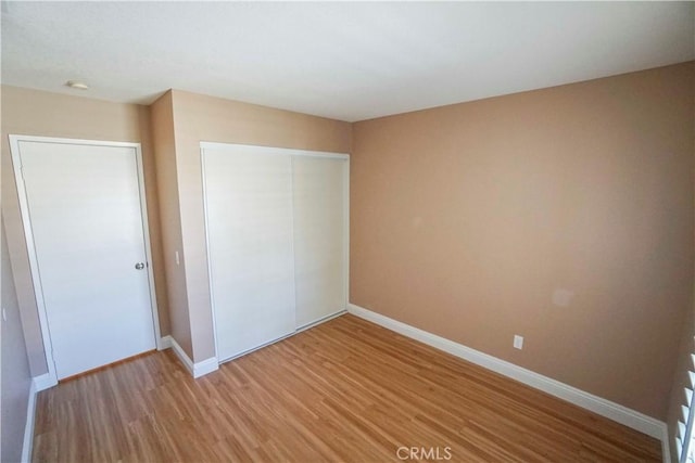 14194 De Sota Dr, Victorville, CA 92392 - unfurnished bedroom featuring light wood-type flooring, a closet, and baseboards