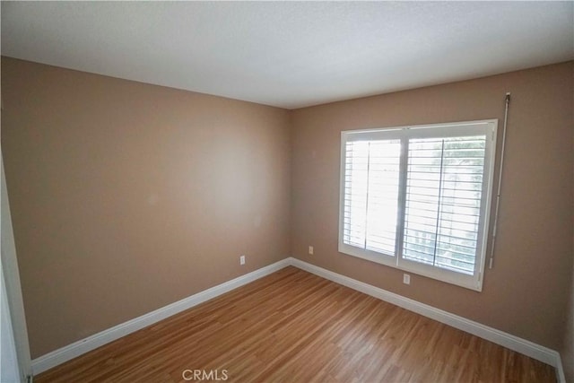 14194 De Sota Dr, Victorville, CA 92392 - empty room featuring light wood-style flooring and baseboards