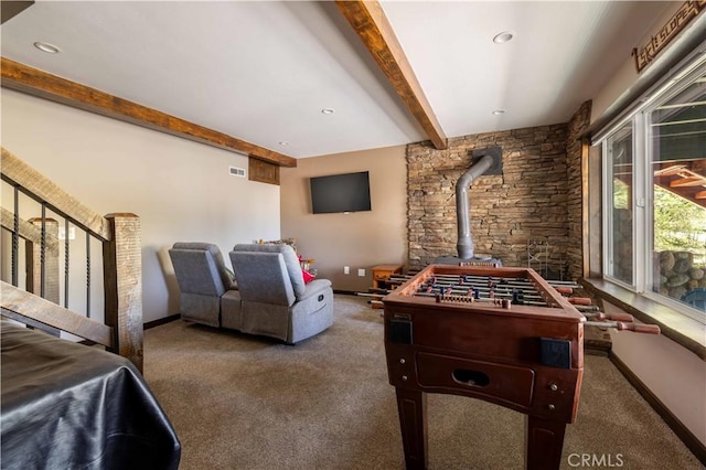 43656 Ridge Crest Dr, Big Bear Lake, CA 92315 - game room featuring carpet floors, beamed ceiling, a wood stove, and baseboards