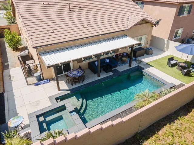 24802 Sandy Trail Pl, Menifee, CA 92584 - outdoor pool featuring a fenced backyard, an in-ground hot tub, outdoor dining area, an outdoor hangout area, and a patio area