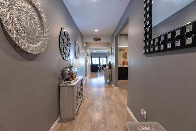 24802 Sandy Trail Pl, Menifee, CA 92584 - corridor featuring light wood-type flooring and baseboards