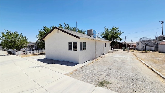 322 S 8th St, Taft, CA 93268 - view of side of property with a patio and stucco siding