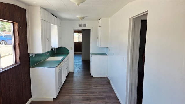 322 S 8th St, Taft, CA 93268 - kitchen with white cabinetry and dark wood finished floors