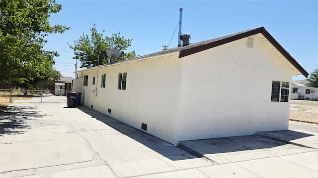 322 S 8th St, Taft, CA 93268 - view of home's exterior with stucco siding, crawl space, and a patio