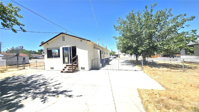 322 S 8th St, Taft, CA 93268 - view of home's exterior featuring entry steps and stucco siding