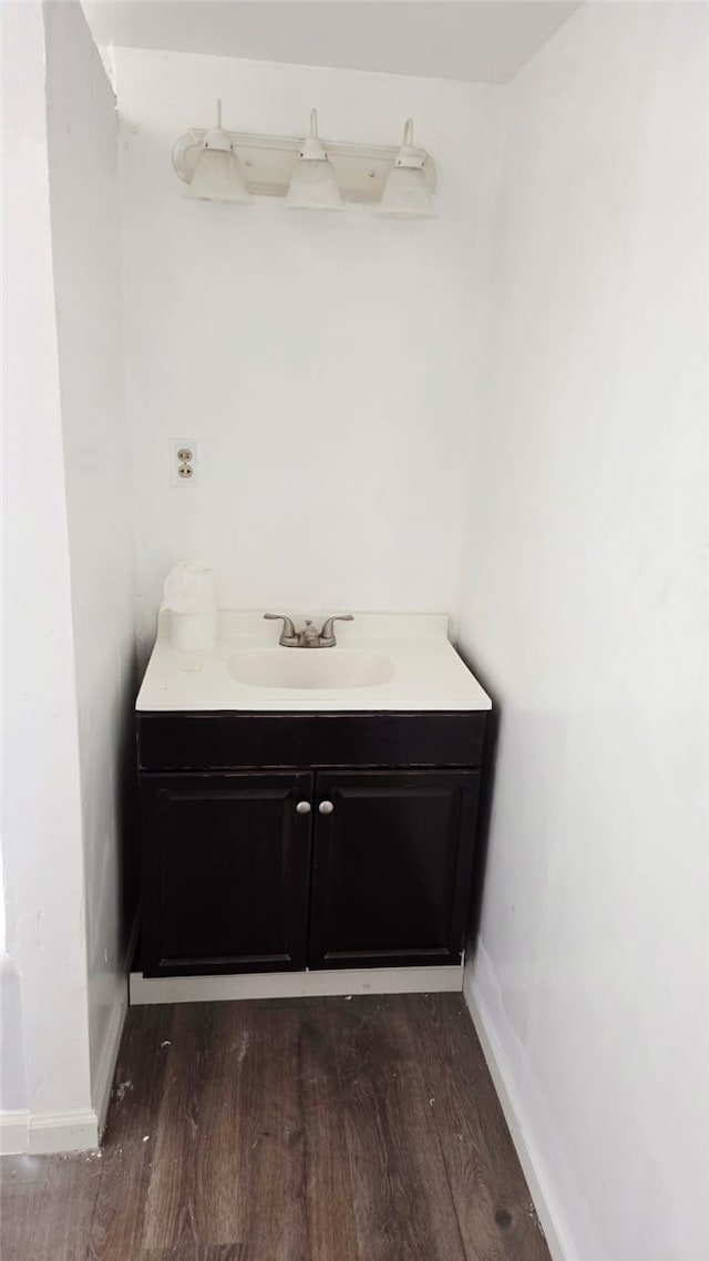 322 S 8th St, Taft, CA 93268 - bathroom with wood finished floors and vanity