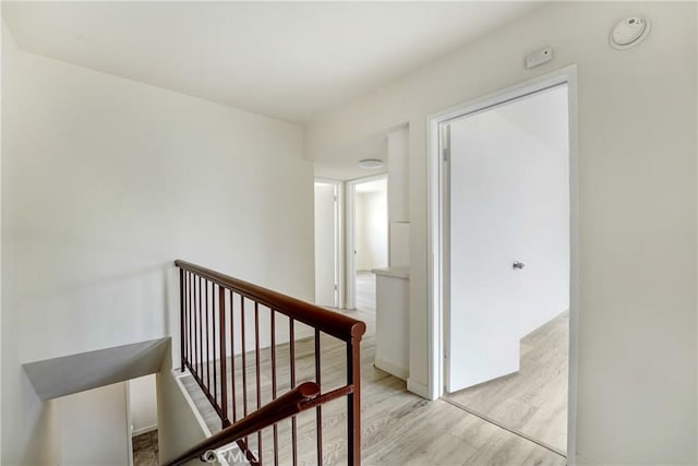 20235 Cohasset St Unit 6, Winnetka, CA 91306 - hall with an upstairs landing and light wood-style floors