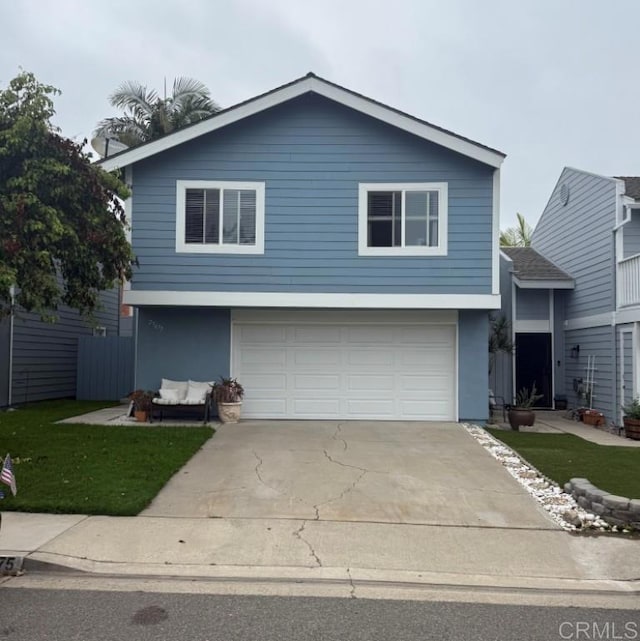 25675 Via Del Rey, San Juan Capistrano, CA 92675 - view of front facade featuring a garage, concrete driveway, stucco siding, and a front yard