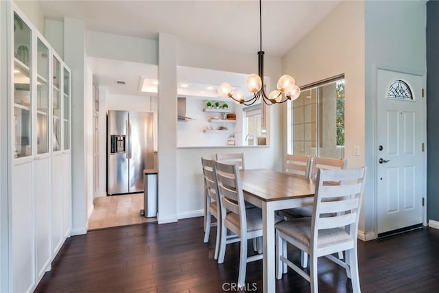 2444 Paseo Circulo, Tustin, CA 92782 - dining space with dark wood finished floors, a chandelier, and baseboards