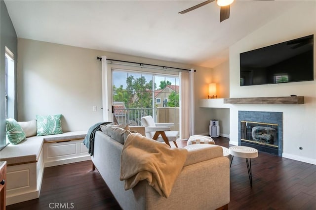 2444 Paseo Circulo, Tustin, CA 92782 - living room featuring ceiling fan, vaulted ceiling, dark wood-type flooring, and a glass covered fireplace