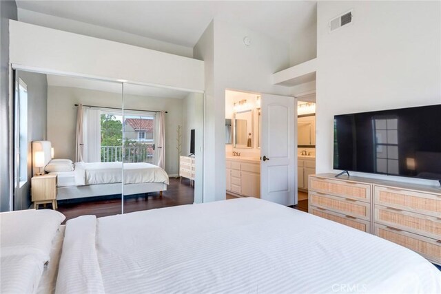 2444 Paseo Circulo, Tustin, CA 92782 - bedroom with a closet, dark wood-style flooring, and connected bathroom