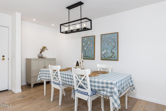4210 Via Arbolada Unit 308, Los Angeles, CA 90042 - dining space featuring light wood-type flooring, recessed lighting, baseboards, and a chandelier