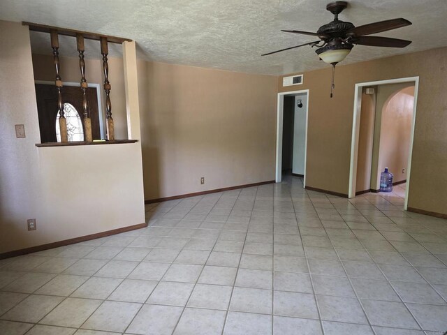 704 S H St, Imperial, CA 92251 - empty room featuring ceiling fan, a textured ceiling, and baseboards
