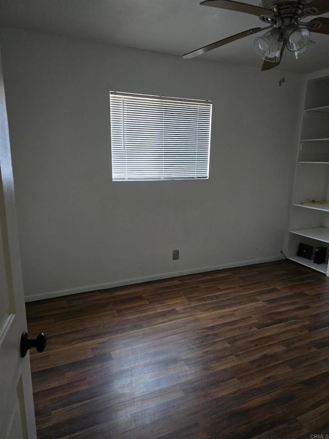 704 S H St, Imperial, CA 92251 - empty room with dark wood-style floors, a ceiling fan, and baseboards