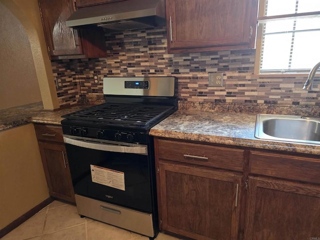 704 S H St, Imperial, CA 92251 - kitchen featuring gas stove, range hood, a sink, and tasteful backsplash