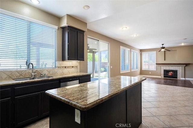 39766 Pinedale Way, Murrieta, CA 92562 - kitchen featuring light tile patterned floors, a ceiling fan, dark cabinets, decorative backsplash, and recessed lighting