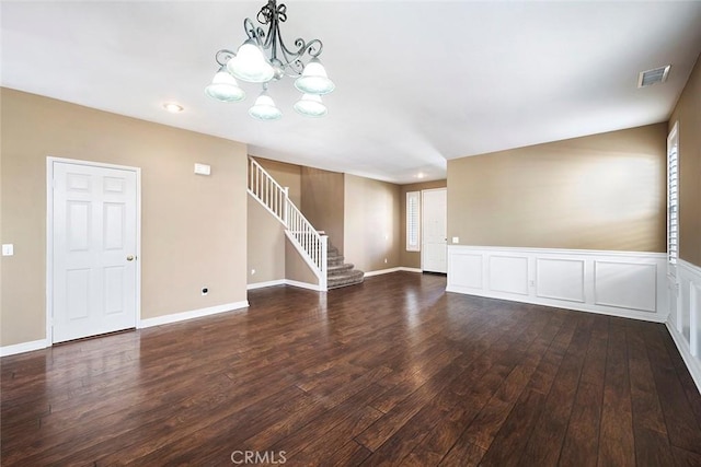 39766 Pinedale Way, Murrieta, CA 92562 - spare room featuring stairway, dark wood finished floors, and a chandelier