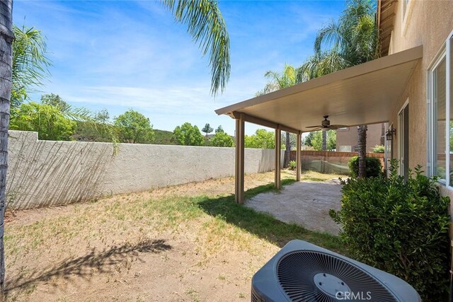 39766 Pinedale Way, Murrieta, CA 92562 - fenced backyard with ceiling fan and a patio area